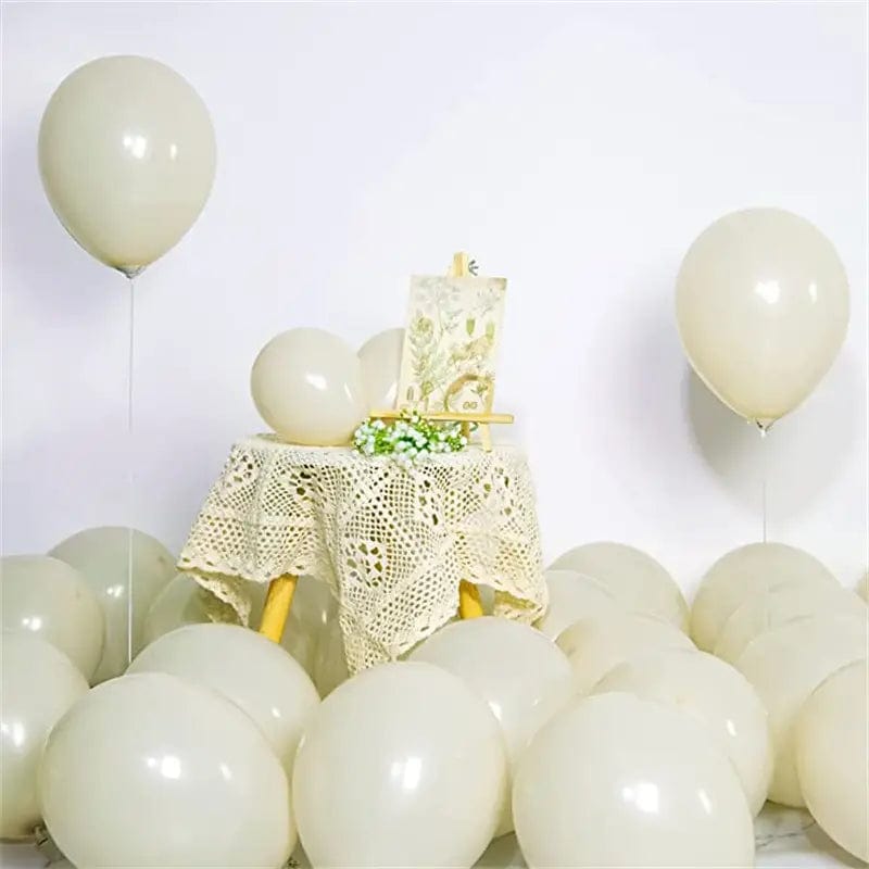 Sand White 10 inch balloons in corner of room