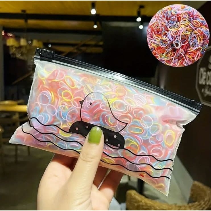 Woman holding colorful mini nylon hair ties set with storage bag 