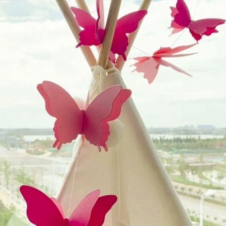 Pink colored butterflies on a string