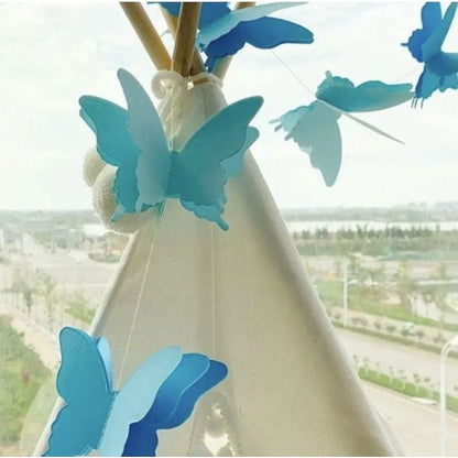 Blue colored butterflies on a string