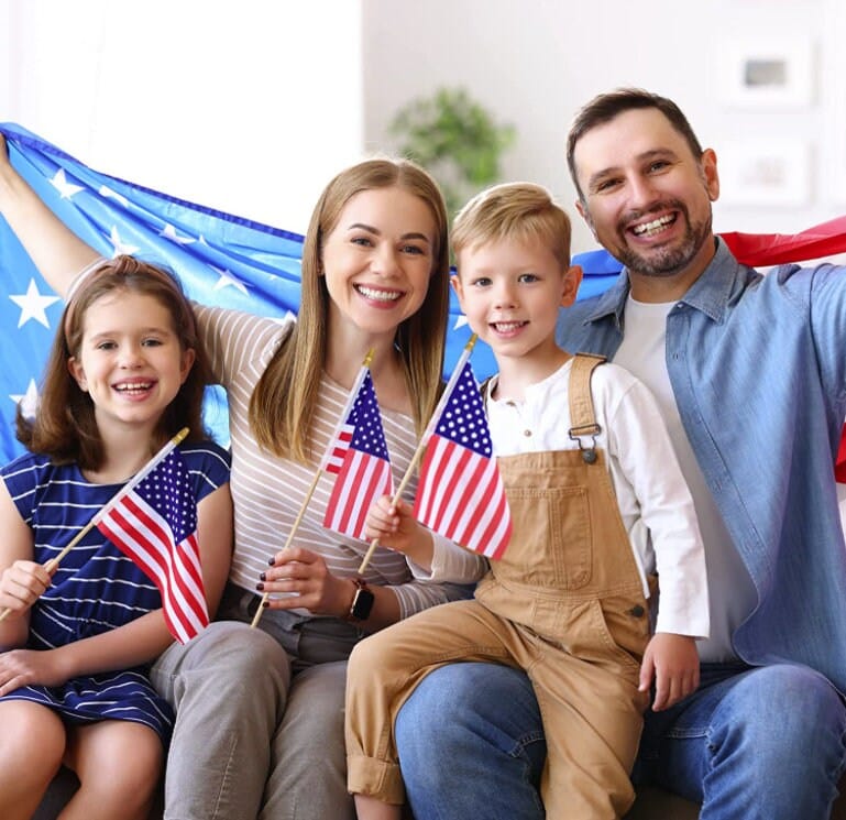 Family photo holding mini American Flags