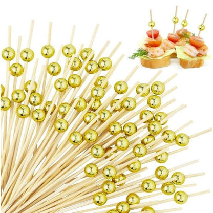 Gold pearls on bamboo sticks 