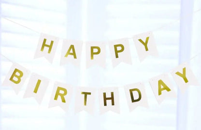 Hanging white happy birthday banner with gold letters