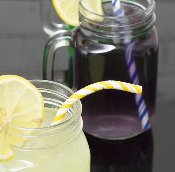 Flexible Yellow paper straw in glass of lemonade 